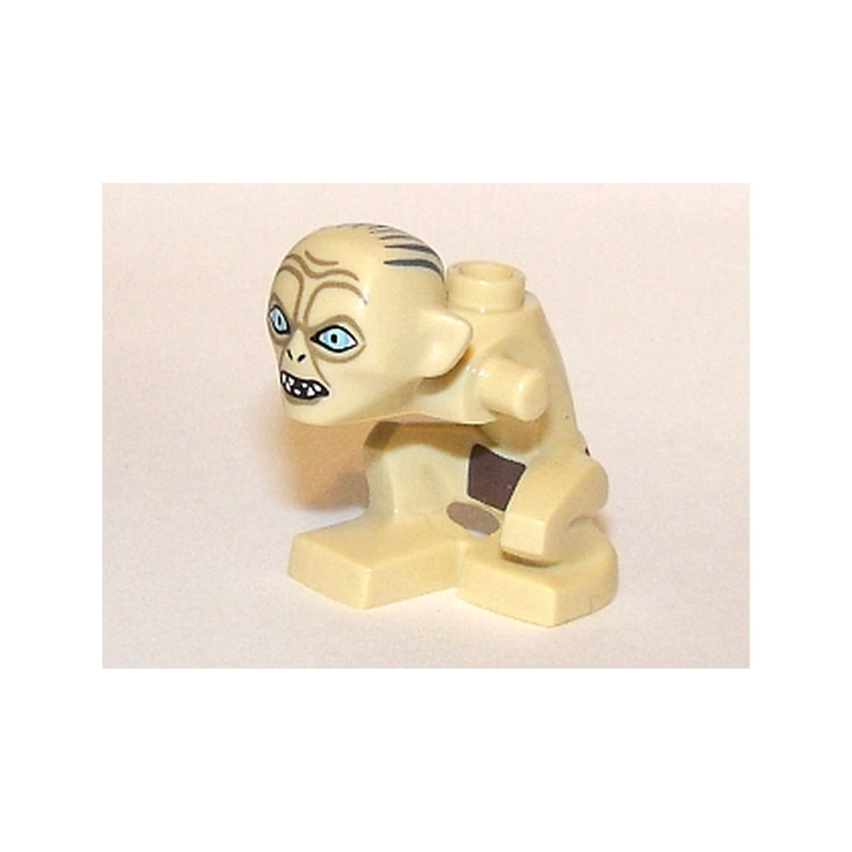 LEGO® Body / Head Gollum, Right Knee Forward with Dark Brown Loincloth, Dark Tan Wrinkles, Dark Bluish Gray Hair, Open Mouth and Narrow Eyes Pattern 10057pb02 beige