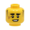 LEGO® Minifigure, Head Black Thick Eyebrows and Stubble Sideburns, Medium Nougat Scar, Lopsided Open Mouth Smile with Teeth Pattern (BAM) 3626pb3315 gelb